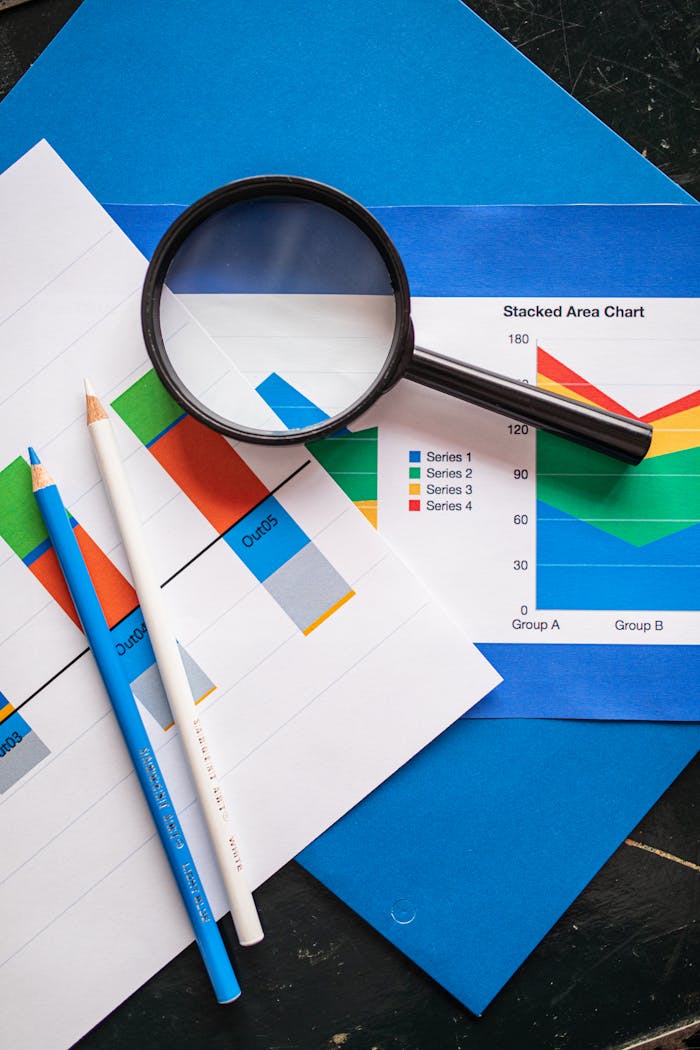 services-04 Image of financial charts and magnifying glass, ideal for business insights.